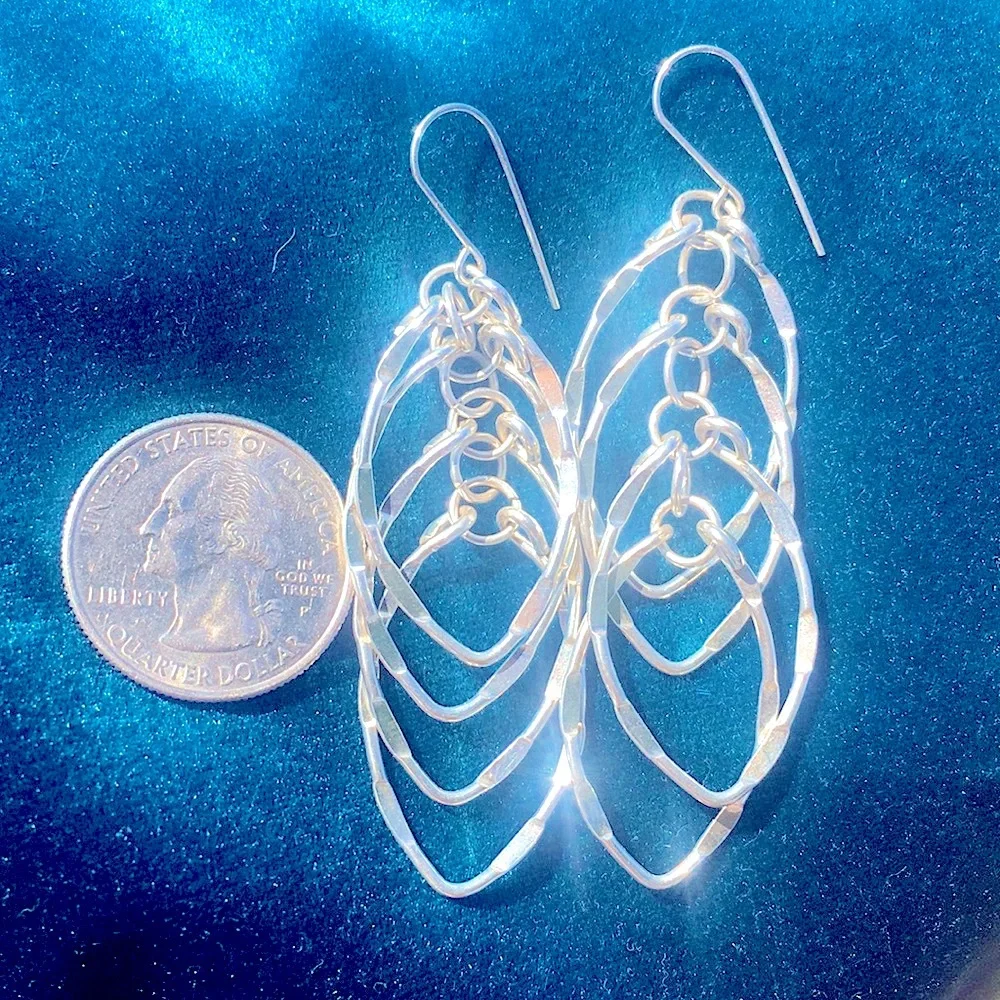 Faceted sparkly faceted swingy silver swingy artisan layered earrings NWOT